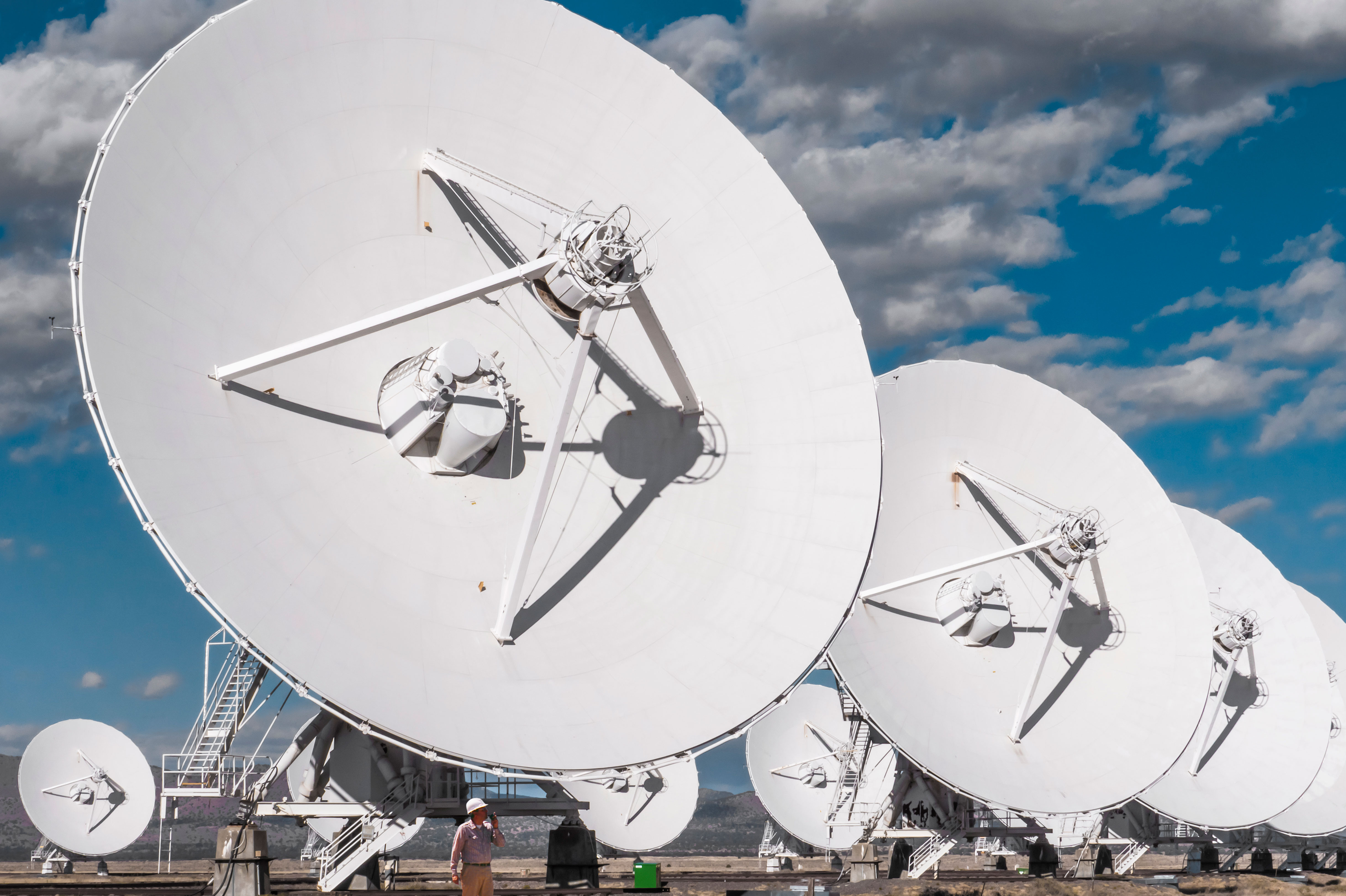 Image of a engineer and satellites.