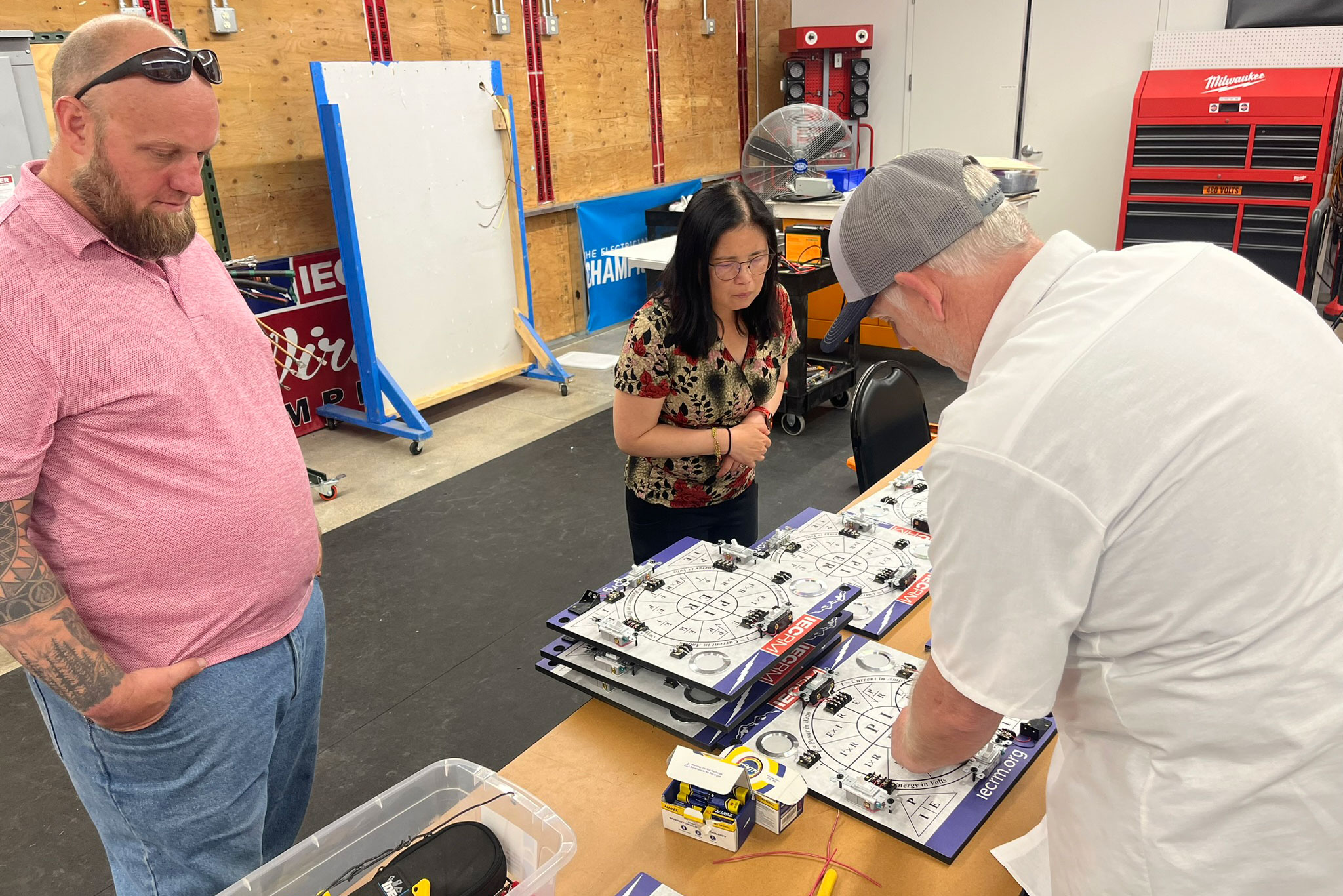 Image of three people working at Encore Electric