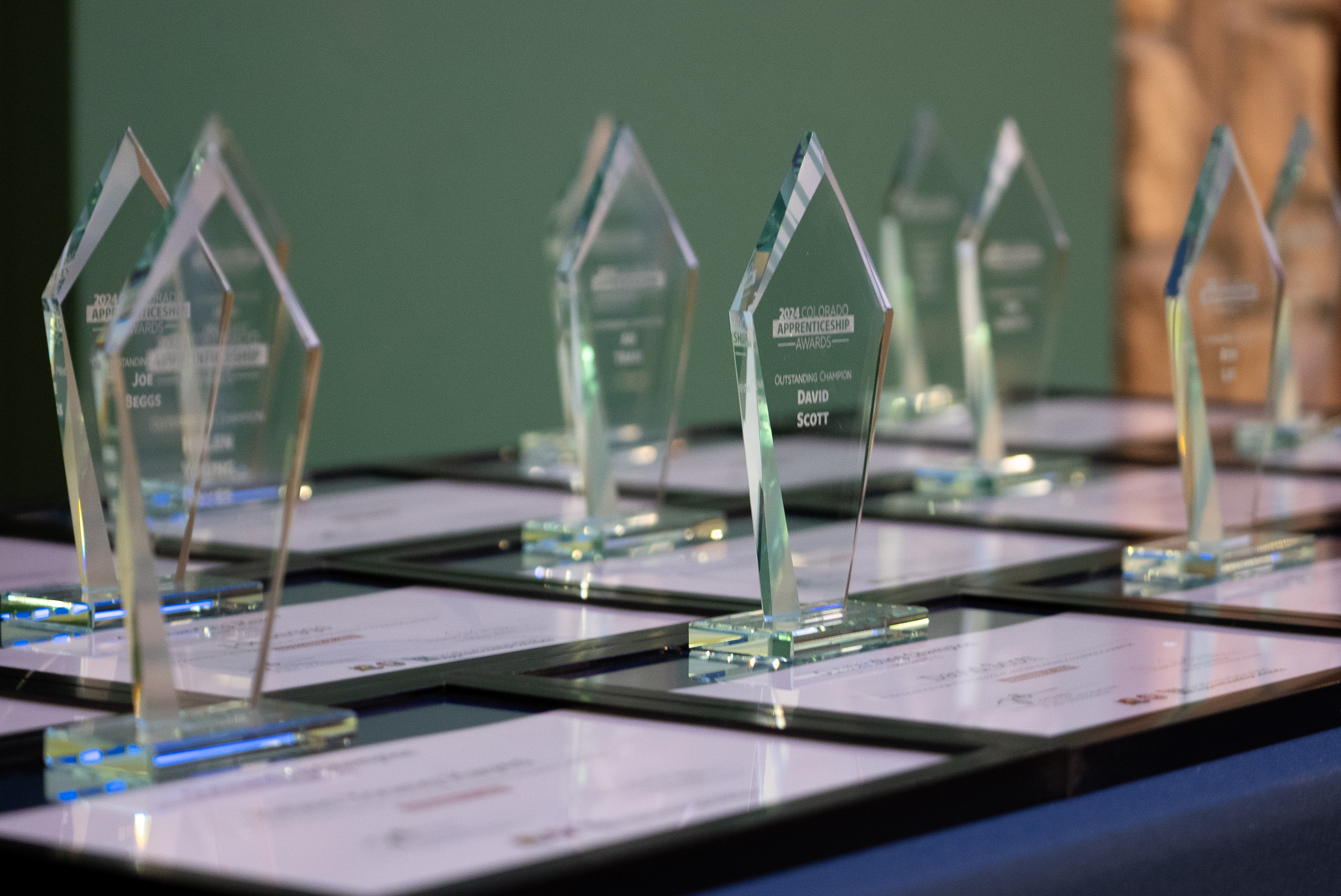 Closeup view of statues and certificates for Apprenticeship Awardees