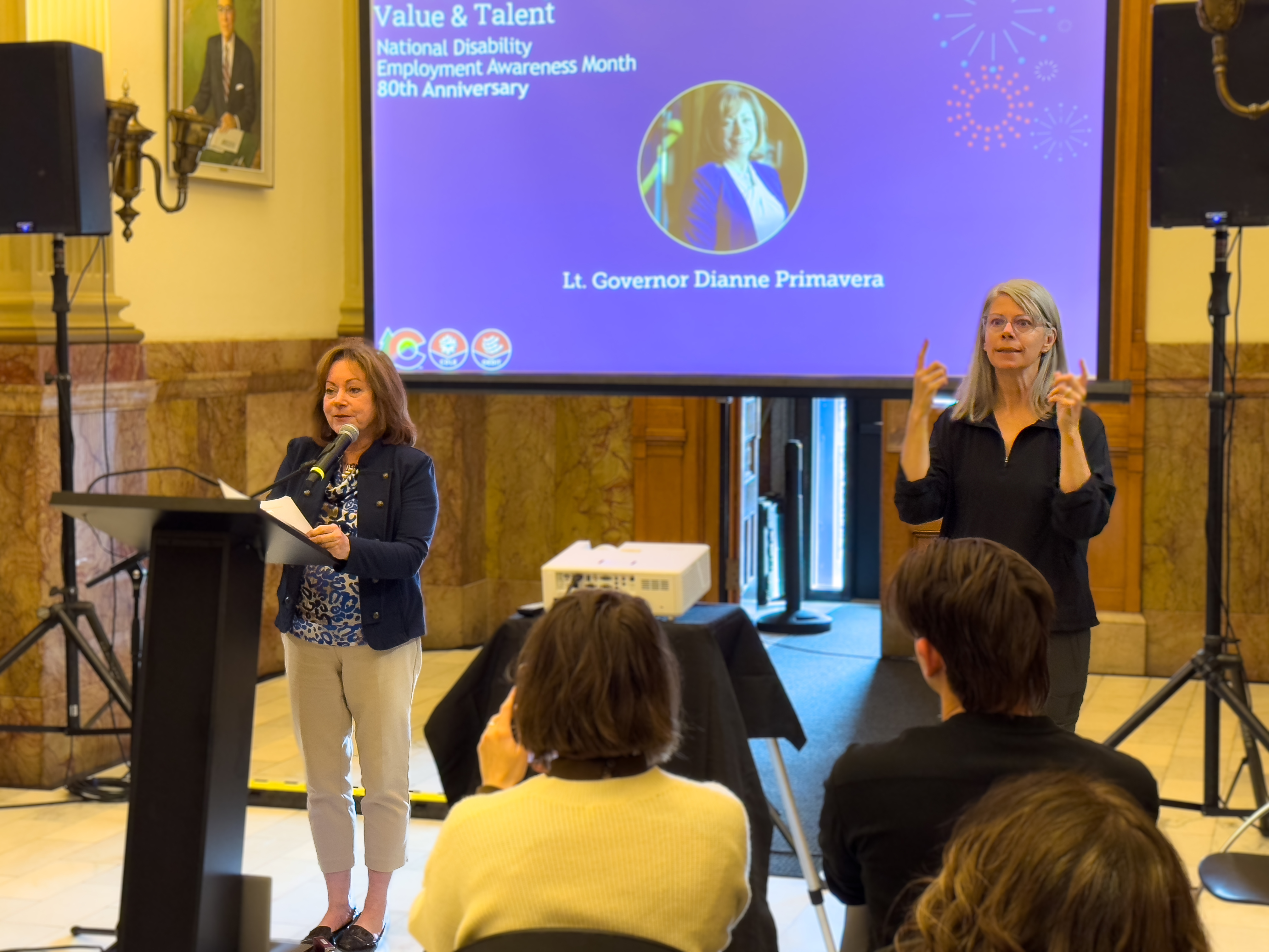 Lt. Governor Primavera presents with an ASL interpreter at the 2025 NDEAM Celebration.